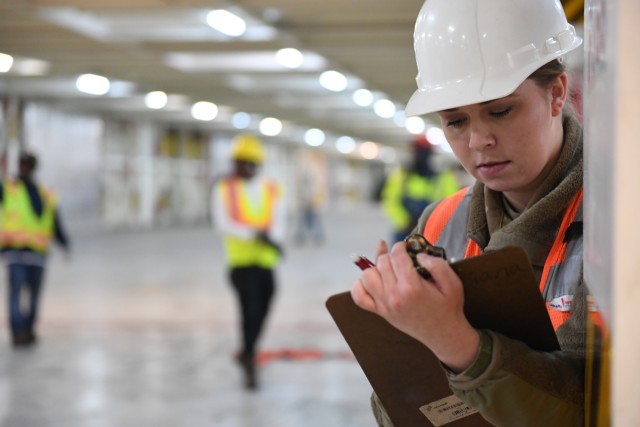 Spc. Marlee Rees, from the 841st Transportation Battalion, verifies stow position of military vehicles on board the Liberty Passion at Naval Weapons Station, Joint Base Charleston. Marine cargo specialists enable the rapid and safe loading of combat power onto ships, while also ensuring cargo is safely transported across the ocean.  (U.S. Army photo/Kimberly Spinner)