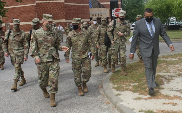 Gen. James McConville, the 40th Chief of Staff of the U.S. Army (left) speaks to Maj. Gen. Rodney Fogg, commanding general of U.S. Army Combined Arms Support Command and Fort Lee, Thursday, April 22, 2021 at Fort Lee, Va. McConville visited the...