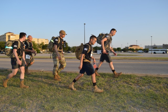Soldiers with Brooke Army Medical Center’s Soldier Recovery Unit work through the 26.2-mile course during the April 10 Bataan Death March remembrance event on Joint Base San Antonio-Fort Sam Houston. The Fort Sam Houston event, which was part of the overall national event normally held in New Mexico but done virtually this year due to the pandemic, pays respect to the American and Filipino Soldiers who were forced to march more than 65 miles under brutal conditions. 
(U.S. Army photo by Daniel J. Calderón)