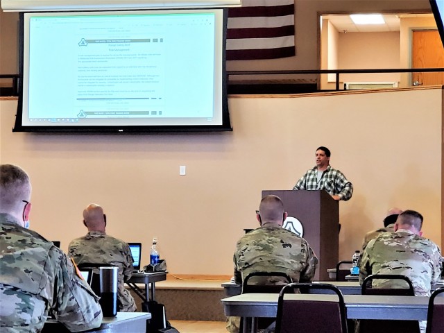 Brad Vieth, range safety officer with the Fort McCoy Directorate of Plans, Training, Mobilization and Security (DPTMS), briefs 23 service members attending the DPTMS Training Workshop on April 8, 2021, in building 905 at Fort McCoy, Wis. This was the first workshop held by the directorate to assist unit representatives with the processes and requirements to schedule and hold training at Fort McCoy. The workshop took place April 7-8 and participants learned about range safety, range operations, range maps, and more. (U.S. Army Photo by Scott T. Sturkol, Public Affairs Office, Fort McCoy, Wis.)