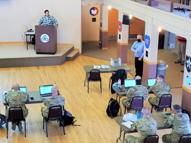 Brad Vieth, range safety officer with the Fort McCoy Directorate of Plans, Training, Mobilization and Security (DPTMS), briefs 23 service members attending the DPTMS Training Workshop on April 8, 2021, in building 905 at Fort McCoy, Wis. This was the first workshop held by the directorate to assist unit representatives with the processes and requirements to schedule and hold training at Fort McCoy. The workshop took place April 7-8 and participants learned about range safety, range operations, range maps, and more. (U.S. Army Photo by Scott T. Sturkol, Public Affairs Office, Fort McCoy, Wis.)