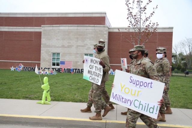 Soldiers from the 1st Theater Sustainment Command depart Kingsolver Elementary School at Fort Knox, Kentucky, April 23, 2021 after cheering on and providing encouragement to the children arriving for class .The month of April is designated as Month of the Military Child to let children know that their resiliency and ability to change and adapt is appreciated.   during the Month of the Military Child. (U.S. Army photo by Staff Sgt. Nahjier Williams, 1st TSC PAO)