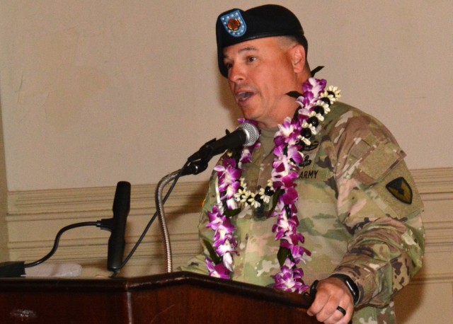 Command Sgt. Maj. James D. House thanks the military leaders who supported and mentored him and acknowledges the talent and expertise of civilian professionals on the garrison team during an April 23 change of responsibility ceremony at Fort Lee, Va. He is wearing a flowered lei that was presented by Garrison Commander Col. Karin L. Watson who hails from Guam. Command Sgt. Maj. Tamisha A. Love replaced House who has been reassigned to Joint Base San Antonio-Fort Sam Houston, Texas, where he will service as the Installation Management Command G-4 CSM. (U.S. Army photo by Patrick Buffett)