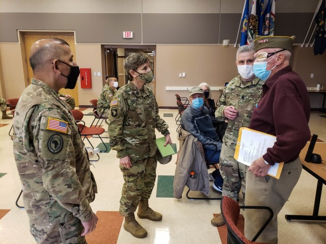 Tom Sitter (right), World War II veteran and Days of Remembrance speaker is welcomed by Maj. Gen. Miguel A. Castellanos (left), commanding general, 84th Training Command, accompanied by Brig. Gen. Stacy Babcock, commanding general, 86th Training...