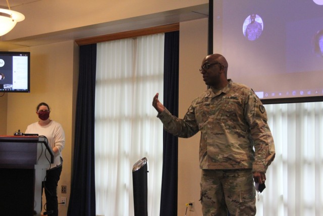 Dale Gibson (left) and Chaplain (Maj.) Robert Rand speak to Fort McCoy, Wis., community members at the celebration luncheon for and last class of Financial Peace University on March 16, 2021, at McCoy's Community Center. The class, which offers...