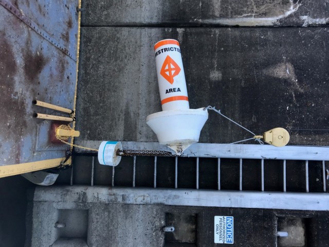 A plastic buoy and counterweight at Lock and Dam 9, near Lynxville, Wisconsin.