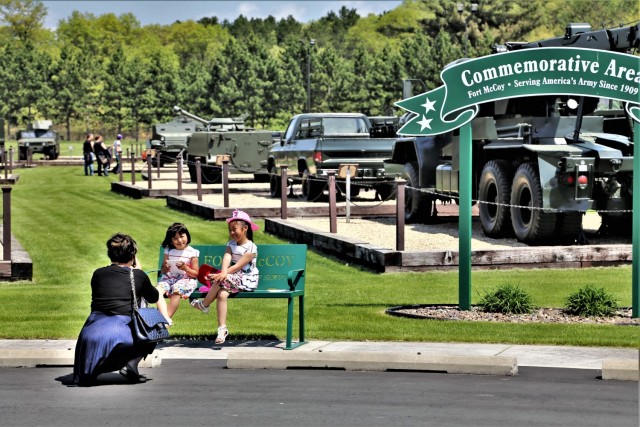 Visitors stop by the Commemorative Area during the Fort McCoy Armed Forces Day Open House on May 19, 2018, at Fort McCoy, Wis. An estimated 4,000 people or more attended the open house. The open house was held on the grounds of Fort McCoy’s historic Commemorative Area, which includes World War II-era buildings, the Equipment Park, and Veterans Memorial Plaza. People lined up for camouflage face painting, personalized ID tags, an interactive-marksmanship gallery, and military-vehicle and fire-truck displays. They also saw the latest Army medical equipment in use, filled sandbags to build a mock defensive position, and more. (U.S. Army Photo by Scott T. Sturkol, Public Affairs Office, Fort McCoy, Wis.)