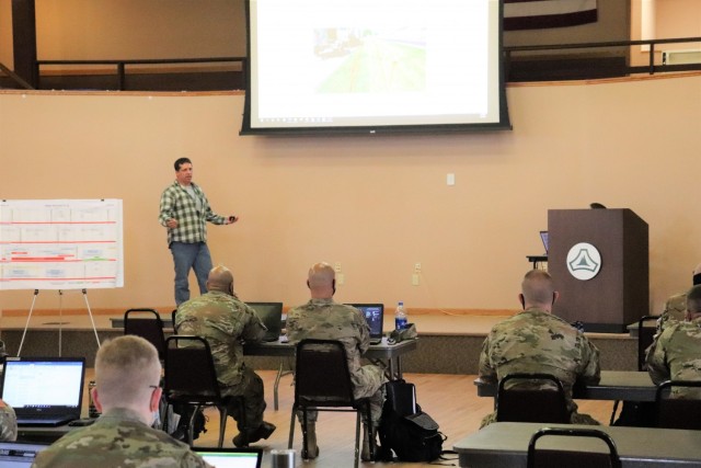 Brad Vieth, range safety officer with the Fort McCoy Directorate of Plans, Training, Mobilization and Security (DPTMS), briefs 23 service members attending the DPTMS Training Workshop on April 8, 2021, in building 905 at Fort McCoy, Wis. This was the first workshop held by the directorate to assist unit representatives with the processes and requirements to schedule and hold training at Fort McCoy. The workshop took place April 7-8 and participants learned about range safety, range operations, range maps, and more. (U.S. Army Photo by Scott T. Sturkol, Public Affairs Office, Fort McCoy, Wis.)