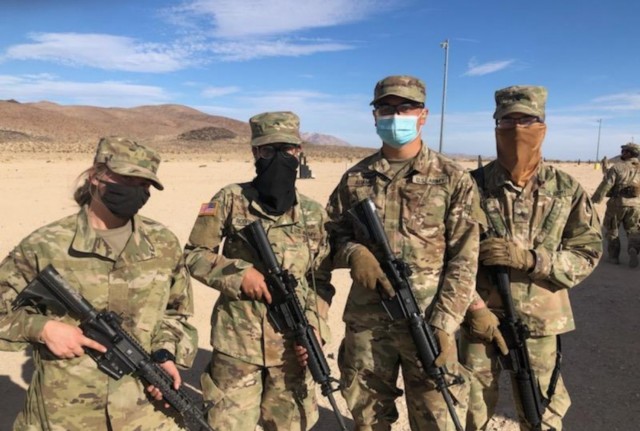 CDT Adams with fellow CDTs Bragg and Rodriguez and a CDT from Cal State Fullerton during marksmanship training at Ft. Irwin, CA.
