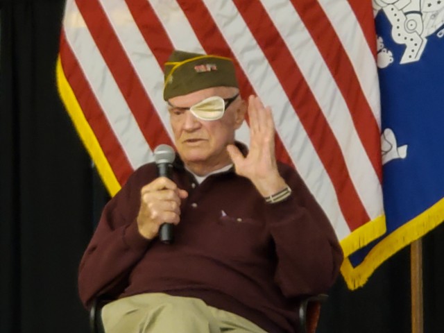 Tom Sitter, World War II veteran and Days of Remembrance speaker describes his time in the Army, including the liberation of Dachau, for Soldiers of the 86th Training Division at Fort McCoy, Wis., April 9. (U.S. Army Reserve photo by Sgt. 1st...