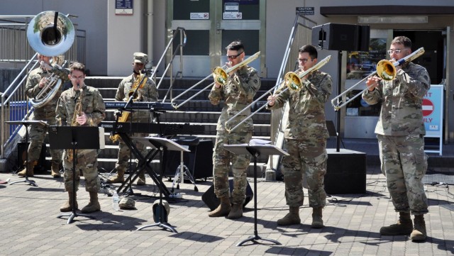 Members of the U.S. Army Japan Band perform during the U.S. Army Garrison Japan Army Community Service pinwheel planting commemoration of National Child Abuse Prevention Month at the Sagamihara Family Housing Area Library, SFHA, Japan, April 23.