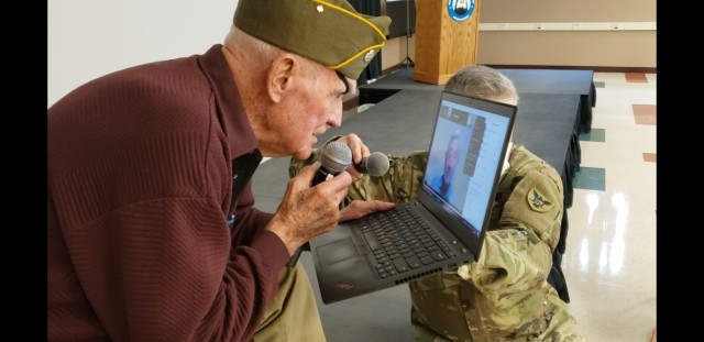 Tom Sitter, World War II veteran and Days of Remembrance speaker for the 86th Training Division is surprised with a teleconference meeting with a Dachau survivor, Elly Gotz, at Fort McCoy, Wis., April 9. Sitter was one of the Soldiers who...