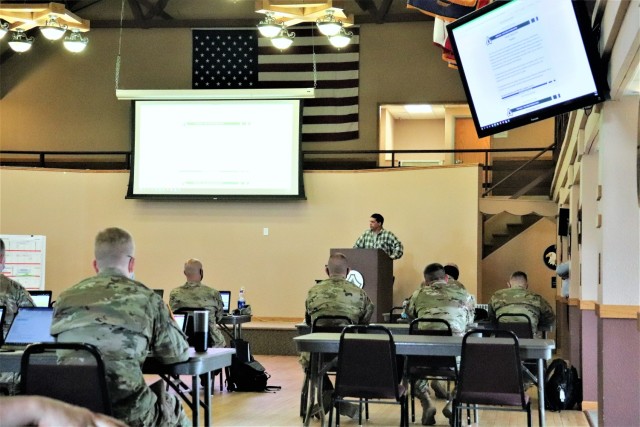 Brad Vieth, range safety officer with the Fort McCoy Directorate of Plans, Training, Mobilization and Security (DPTMS), briefs 23 service members attending the DPTMS Training Workshop on April 8, 2021, in building 905 at Fort McCoy, Wis. This was the first workshop held by the directorate to assist unit representatives with the processes and requirements to schedule and hold training at Fort McCoy. The workshop took place April 7-8 and participants learned about range safety, range operations, range maps, and more. (U.S. Army Photo by Scott T. Sturkol, Public Affairs Office, Fort McCoy, Wis.)