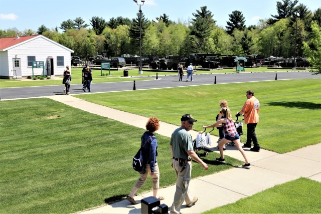 Visitors stop by the Commemorative Area during the Fort McCoy Armed Forces Day Open House on May 19, 2018, at Fort McCoy, Wis. An estimated 4,000 people or more attended the open house. The open house was held on the grounds of Fort McCoy’s historic Commemorative Area, which includes World War II-era buildings, the Equipment Park, and Veterans Memorial Plaza. People lined up for camouflage face painting, personalized ID tags, an interactive-marksmanship gallery, and military-vehicle and fire-truck displays. They also saw the latest Army medical equipment in use, filled sandbags to build a mock defensive position, and more. (U.S. Army Photo by Scott T. Sturkol, Public Affairs Office, Fort McCoy, Wis.)