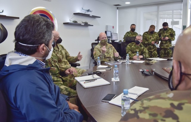 Brig. Gen. Douglas Lowrey, commander of U.S. Army Security Assistance Command, responds to questions during a key leader engagement with the Vice Minister of Defense for strategy and planning, Jairo Garcia Guerrero, blue jacket, and other senior...
