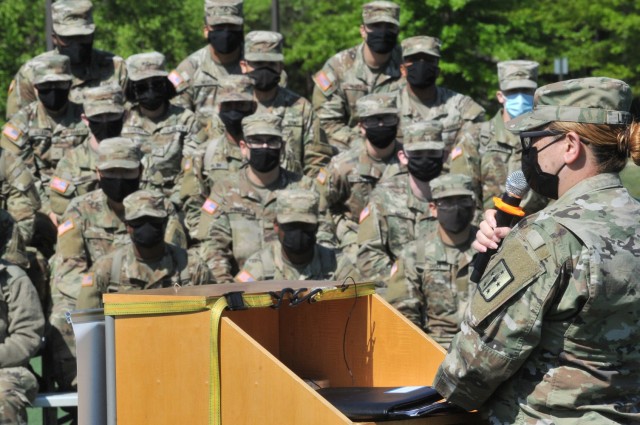 Sgt. 1st Class Denisse Liggens speaks before students at the annual Jumping for SHARP event April 22 at Stillions Field.  She was one of three guest speakers -- all sexual assault survivors -- who shared stories of trauma and recovery with roughly...