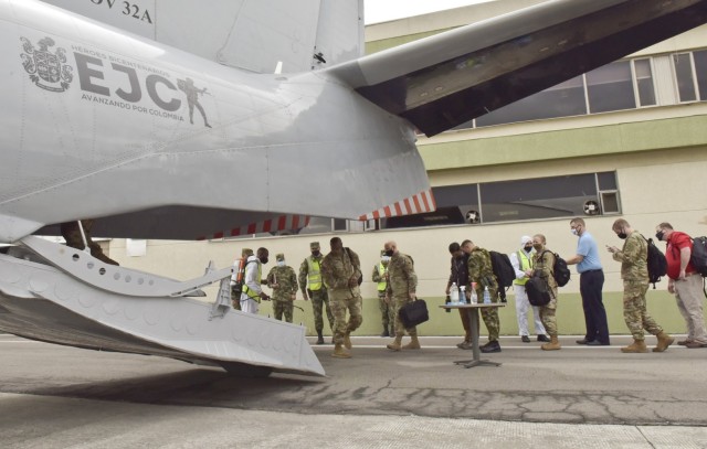 Members of the Colombian and U.S. Army delegation prepare to load the aircraft, 5 April 2021, to travel to an outlying Colombian military post in Colombia. Brig. Gen. Douglas Lowrey, commander of U.S. Army Security Assistance Command, and members of his staff visited several sites to see the impact of U.S. security assistance and foreign military sales, in support of the Colombian military in defending their country from counter-narcotic and internal terrorist threats. (U.S. Army photo by Richard Bumgardner)