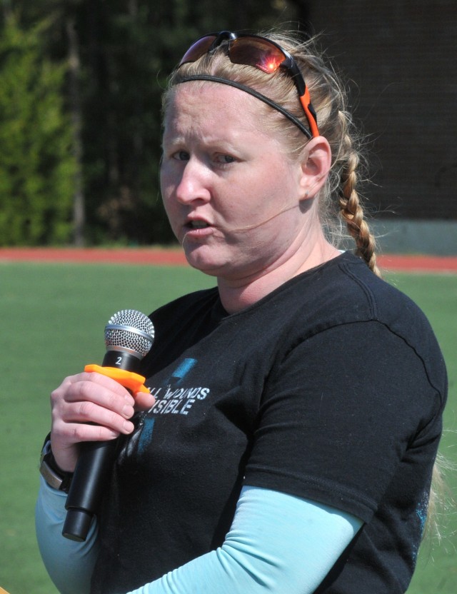 Former Staff Sgt. Elena Rooney speaks before students at the annual Jumping for SHARP event April 22 at Stillions Field.