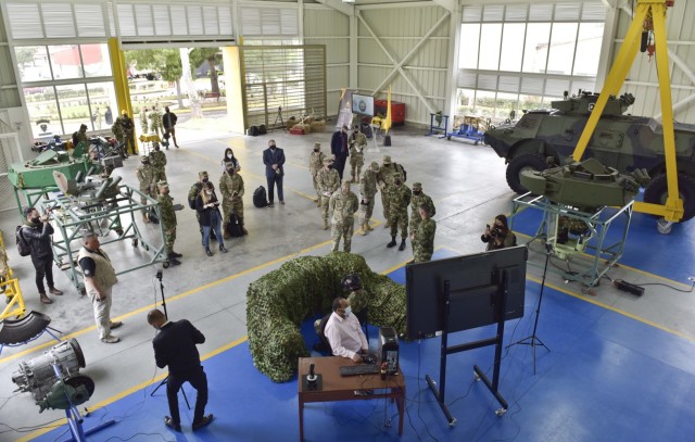 Brig. Gen. Douglas Lowrey, commander of U.S. Army Security Assistance Command, and his staff watch a virtual training session during day 4 of a key leader engagement with the Colombian Army at the Canton Norte base in Bogota, Colombia, 8 April 2021. Brig. Gen. Lowrey, and members of his staff, visited several sites to see the impact of U.S. security assistance and foreign military sales, in support of the Colombian military in defending their country from counter-narcotic and terrorist threats. (U.S. Army photo by Richard Bumgardner)