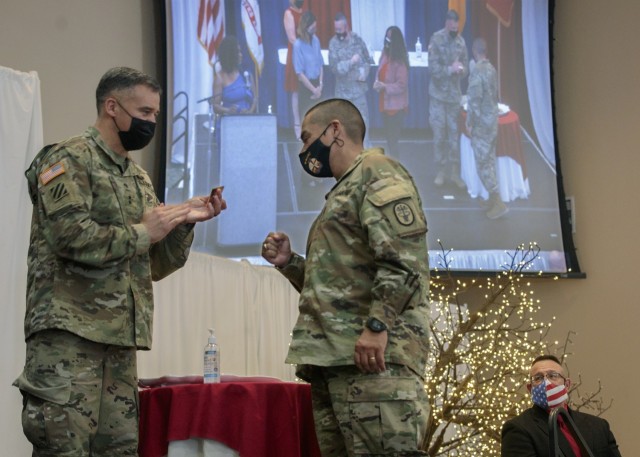 Maj. Gen. Sean Bernabe, the 1st Armored Division and Fort Bliss commanding general, greets an awardee at Fort Bliss, Texas, April 22, 2021. Bernabe and his wife Jayne, an avid military family advocate, participated in the presentation of awards at the 2021 Fort Bliss Annual Volunteer Ceremony.