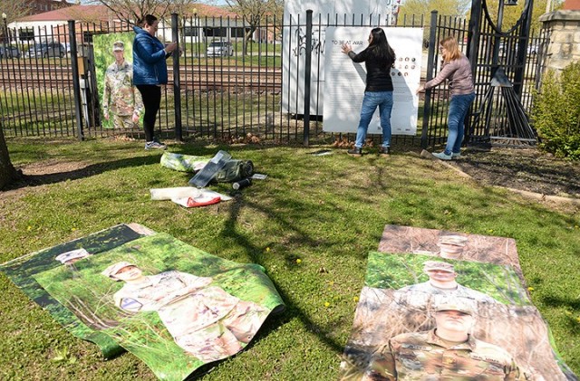 Volunteer Kerry Manneck, "To Be At War" community photography project facilitator Arin Yoon...