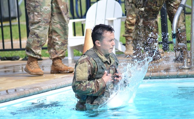 Sgt. Jesus Gil takes the plunge during the Army Combat Water Survival test portion of the Bayne-Jones Army Community Hospital Soldier and Noncommissioned Officer of the Year competition on April 15 at the Joint Readiness Training Center and Fort Polk.

