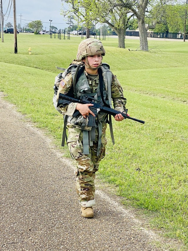 Spc. Vanessa Mundell completes the 12-mile foot march during the Bayne-Jones Army Community Hospital Soldier and Noncommissioned Officer of the Year competition April 15 at the Joint Readiness Training Center and Fort Polk. 
