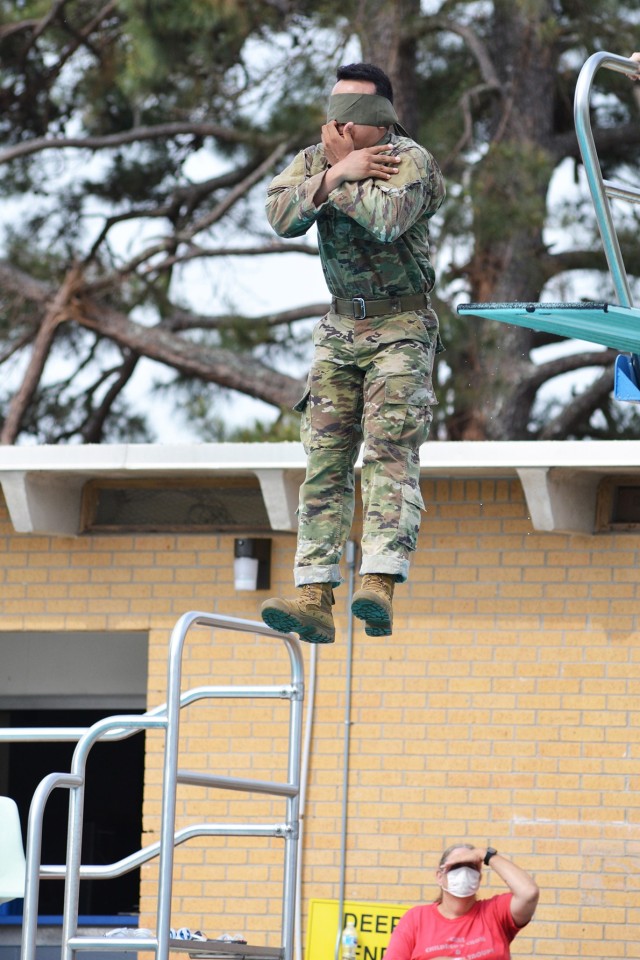 Sgt. Jesus Gil takes a blindfolded plunge from the high dive during Army Combat Water Survival test portion of the Bayne-Jones Army Community Hospital Soldier and Noncommissioned Officer of the Year competition April 15 at the Joint Readiness Training Center and Fort Polk. 
