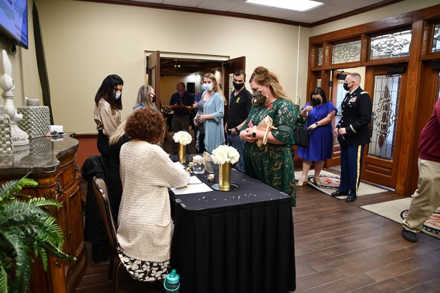 Guests attending the Volunteer of the Year celebration enter the Warrior Center  April 13.