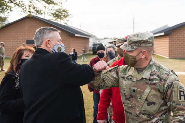 Walter Haag, a 37-year Army Reserves veteran, receives an elbow bump from Lt. Col. Robert McTighe, the commander of 1-310th Brigade Engineer Battalion, 181st Multifunctional Training Brigade, Dec. 17, 2020, at Fort McCoy, Wis.  Haag retired as a...