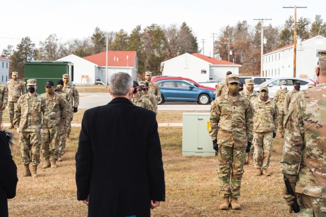 Soldiers of the 181st Multifunctional Training Brigade sing “The Army Goes Rolling Along,” to Walter Haag, a 37-year Army Reserves veteran, Dec. 17, 2020, at Fort McCoy, Wis.  Haag commissioned as an officer of the Medical Service Corps in...