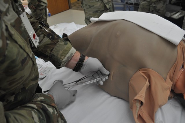 Martin Army Community Hospital's graudating residents practiced inserting a chest tube as part of the FMRx, a 3-day operational medicine course.
