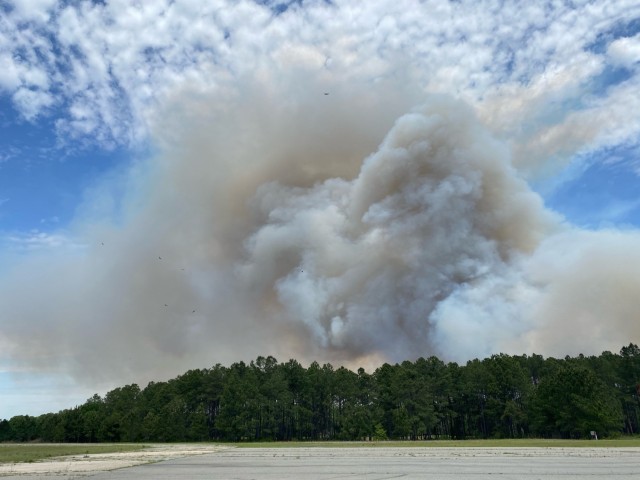A smoke plume covers the horizon following a controlled burn, April 23 on Fort Stewart, Georgia. A large smoke plume hap-pens from several small fires burning together quickly to form a large fire.