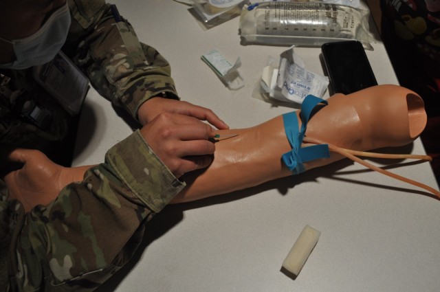 Martin Army Community Hospital 3rd-year resident Capt. Mark Betten practiced inserting a peripheral IV.