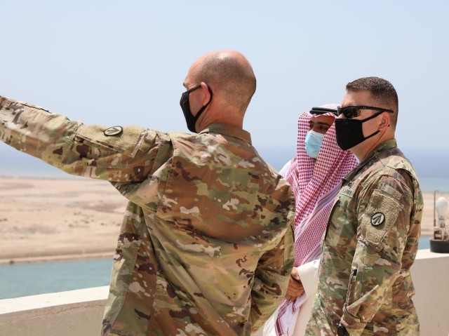 Col. Michael Ludwick, commander of the 595th Transportation Brigade (SDDC) and Lt. Col. Andrew Kocsis, commander of the 840th Transportation Battalion (SDDC), receive a tour of the commercial port at Yanbu, Kingdom of Saudi Arabia, from Mr. Rami...