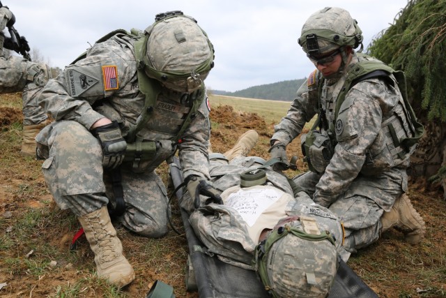 U.S. Soldiers assigned to Bravo Troop, 1st Squadron, 2nd Cavalry Division strap in a simulated wounded Soldier to a litter while conducting a movement to contact drill during exercise Saber Junction 15 at the U.S. Army’s Joint Multinational Readiness Center in Hohenfels, Germany, April 12, 2015. Saber Junction 15 prepares NATO and partner nation forces for offensive, defensive, and stability operations and promotes interoperability among participants. Saber Junction 15 has more than 4,700 participants from 17 countries, to include: Albania, Armenia, Belgium, Bosnia, Bulgaria, Great Britain, Hungary, Latvia, Lithuania, Luxembourg, Macedonia, Moldova, Poland, Romania, Sweden, Turkey, and the U.S. (U.S. Army photo by Spc. Brian Chaney/Released)