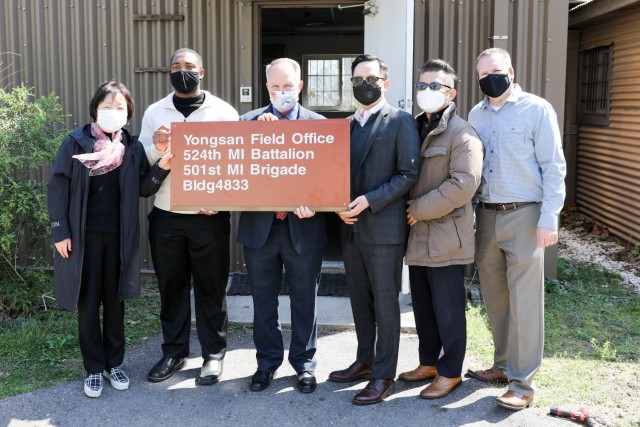 Yongsan Field Office Staff Pose with Sign