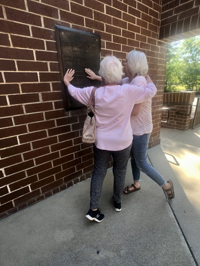 Gold Star Spouse Nancy Jacobs and daughter Kristy Drews observe the memorial plaque placed outside Bryan-Vogt Hall, April 22 on Fort Stewart.