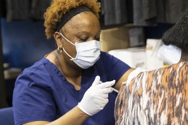 A Northeast Alabama Regional Medical Center nurse administers a COVID-19 vaccination April 22 during a vaccination clinic at Anniston Army Depot.