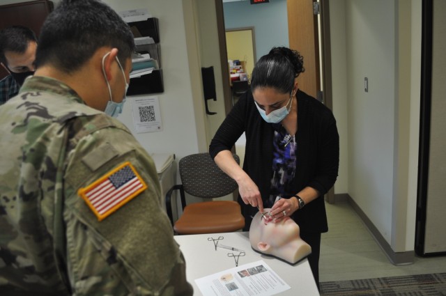 University of Maryland Medical Center Opthalmologist Dr. Dona Richa walked 3rd-year residents Capt. Cordell Hachinsky and Capt. Mark Betten through a Lateral Canthotomy and Cantholysis (LCC).