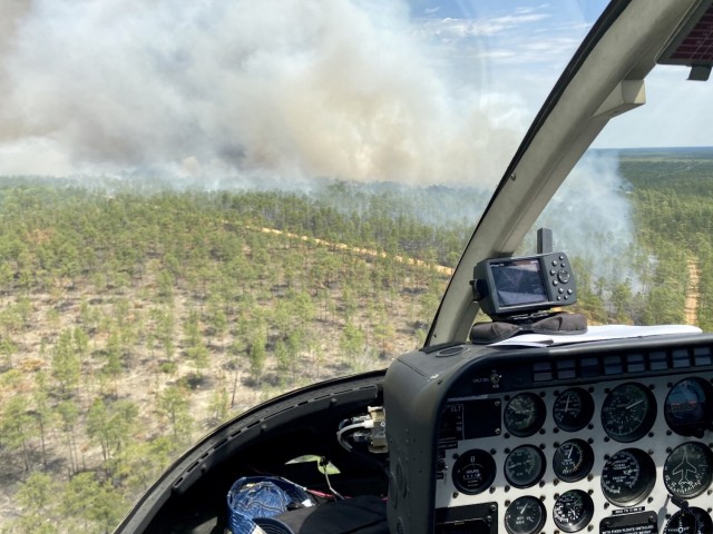 A smoke plume is seen from above following a controlled burn, April 23 on Fort Stewart, Georgia. The contracted helicopter is used to drop small balls of incendiary substances to burn hardwood plants in the Fort Stewart-Hunter Army Airfield...