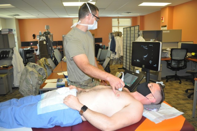 Martin Army Community Hospital 3rd-year resident Capt. S. Ivan Bartlett practiced Extended Focused Assessment with Sonography for Trauma (eFAST) readings.