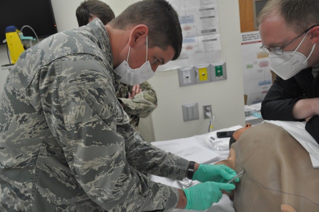 Martin Army Community Hospital's 3rd-year resident Capt. Weston Pratt practiced inserting a chest tube, under the guidance of Emergency Physician Capt. Jacob Arnold.