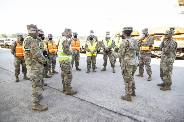 Anniston Army Depot SGM, Happiness Brown, (center) and Defense Logistics Agency Distribution Anniston, Ala. Commander, Lt. Col. Oladipofaniyi, brief Soldiers from the 757th Expeditionary Rail Center prior to a RAIL demonstration at ANAD.