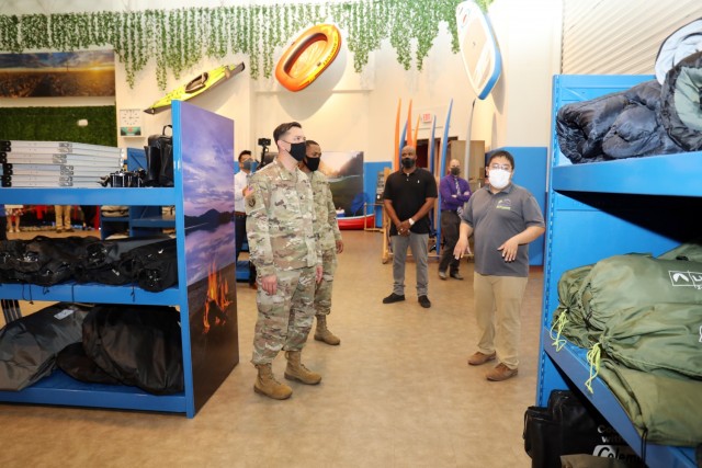 Col. Thomas Matelski, left, commander of U.S. Army Garrison Japan, and USAG Japan Command Sgt. Maj. Justin Turner tour the new Outdoor Recreation facility at Camp Zama, Japan, April 29. Hiro Huertas, right, Outdoor Recreation manager, briefs Matelski and Turner.