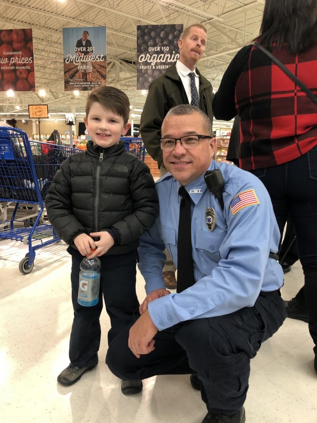 Mark Colley, a volunteer firefighter with the New Haven, Mich. Fire Department, is teamed up with a youngster in the community for the “Shop with a Hero” event in Dec. 2018.  Colley has volunteered with the New Haven Fire Department for three-and-a-half years.