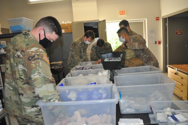 Doctors from Martin Army Community Hospital's Family Medicine Residency Program pack their medical kits to treat a mass casualty as part of their 3-day operational medicine course, Family Medicine Residency Experience.