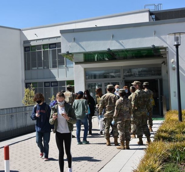 Soldiers with the 102nd Signal Battalion volunteered to salute students at Wiesbaden High School during Month of the Military Child April 23.