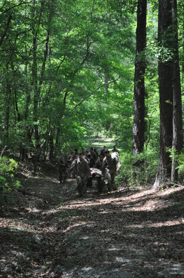 Doctors from Martin Army Community Hospital's Family Medicine Residency Program evacuate a casualty during an exercise at the Medical Simulation Training Center as part of their 3-day operational medicine course, Family Medicine Residency Experience.