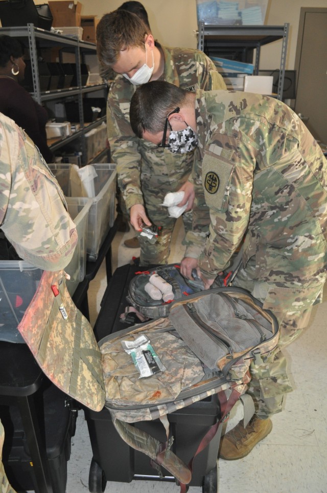Doctors from Martin Army Community Hospital's Family Medicine Residency Program pack their medical kits to treat a mass casualty as part of their 3-day operational medicine course, Family Medicine Residency Experience.